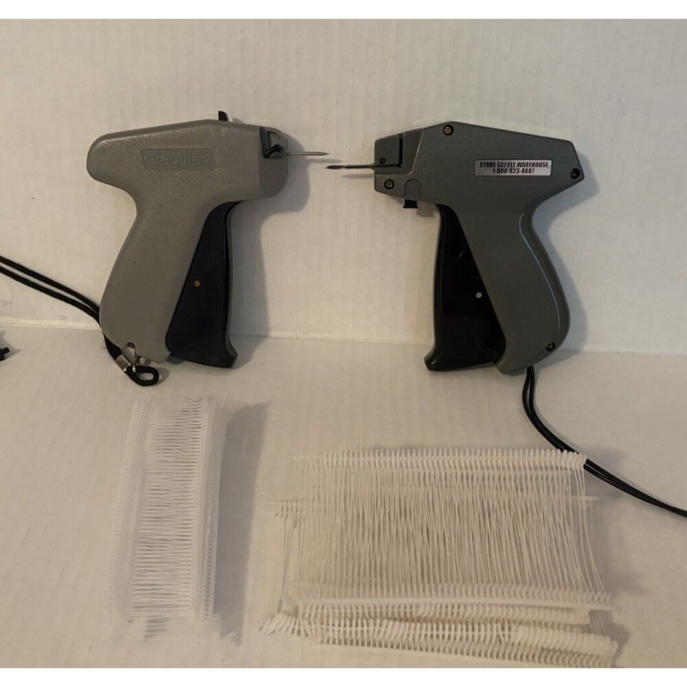 2 Monarch Tag Attacher Guns w/ 150 normal tags & 7 short tags With Needles